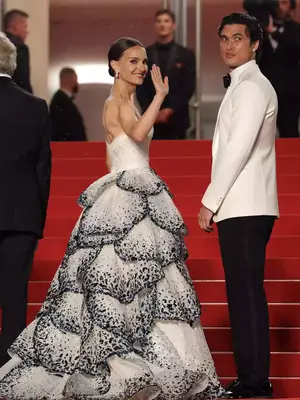 Natalie Portman wears the Dior Junon gown from 1949 and Charles Melton wears an Armani suit to the 2023 Cannes Film Festival