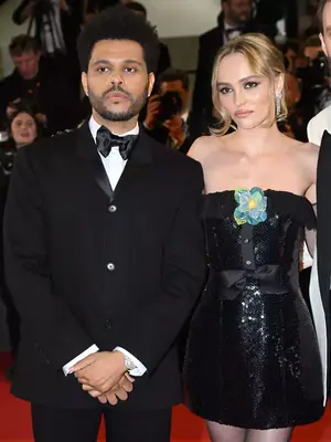 The Weeknd/Abel Tesfaye wears a tuxedo and Lily-Rose Depp wears a Chanel Fall 1994 minidress to the Cannes premiere of The Idol