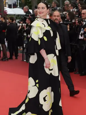 Lily Gladstone wears a black and yellow floral Valentino couture gown to the 2023 Cannes Film Festival