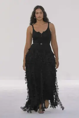 Model wears black gown with henley bodice and textural skirt at the Brandon Maxwell spring 2025 show