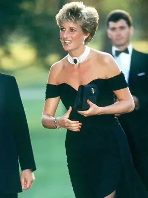 Princess Diana wearing black revenge dress, layered pearl necklace, and pearl earrings