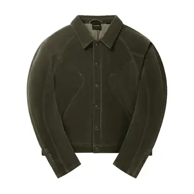 Katie Holmes wears a green and pink barn jacket, wide leg jeans, and white sneakers while carrying white and red monogrammed Lands