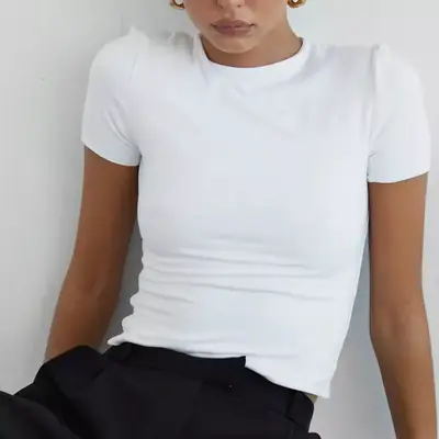 Re Ona white t-shirt on model styled with black trousers