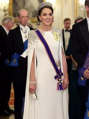 Kate Middleton wearing embellished white gown with crown