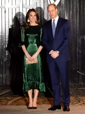 Kate Middleton wearing green metallic midi gown with gold clutch and earrings