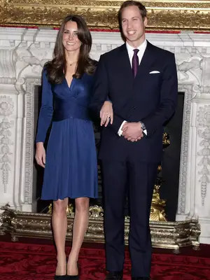 Kate Middleton wearing a long sleeve navy dress 
