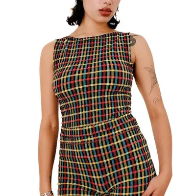 model wearing a rainbow tartan top and shorts