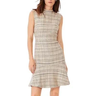 model wearing a tailored dress with an uneven plaid print