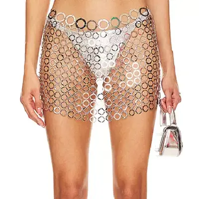 H:Ours Silvie Mini Skirt in silver circular chainmail on model over white bikini bottom and paired with silver handbag