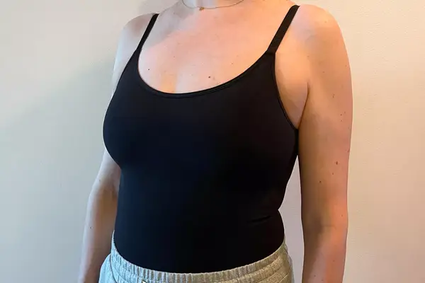 The front view of a person wearing the Shapermint Essentials All Day Every Day Scoop Neck Bodysuit