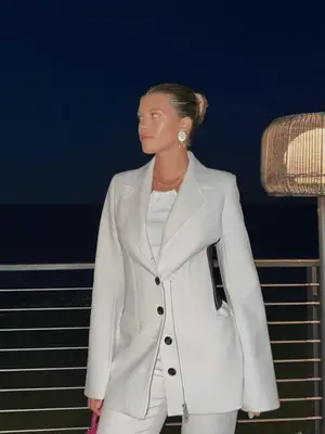 Sofia Richie Grainge in a cream suit and oversized earrings