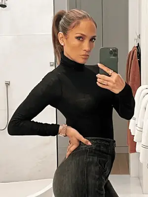 Jennifer Lopez wears a black turtleneck 