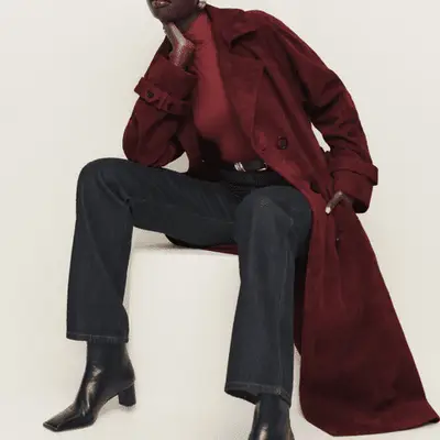 Woman wearing burgundy suede trench coat 