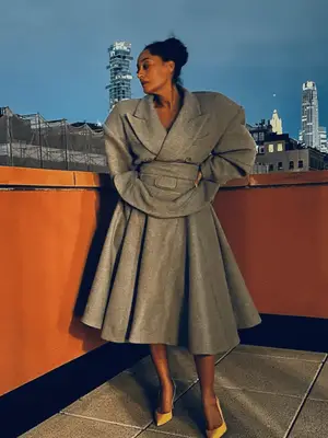 Tracee Ellis Ross wearing a gray blazer and skirt set with heels
