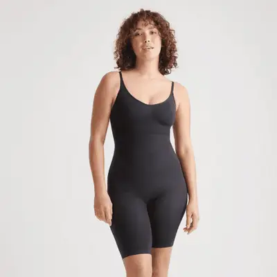 Photo of woman wearing black shapewear bodysuit