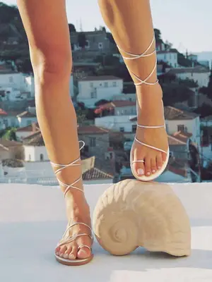 Dolce Vita Wink Sandals in black leather with gold metal accents