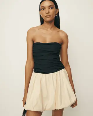 model wearing a white bubble skirt