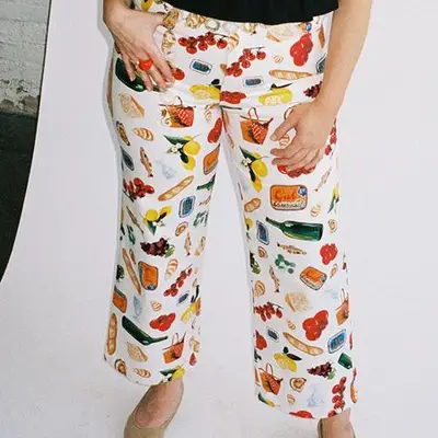 White denim pants with an Italian summer-themed print