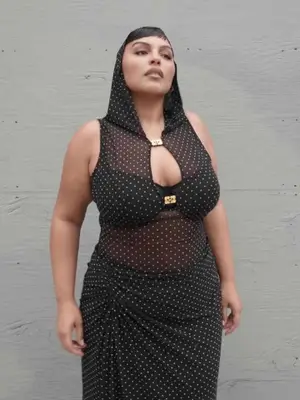 Paloma Elsesser wearing a polka-dotted dress with hood