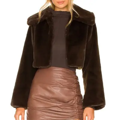 Camila Coelho Cleobella Cropped Faux Fur Jacket in dark brown on model styled with brown bodysuit and skirt