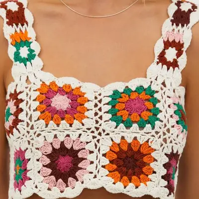 Close up of a model wearing a granny square crop top 