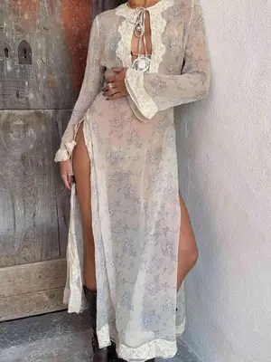 model wearing a sheer floral swimsuit cover up