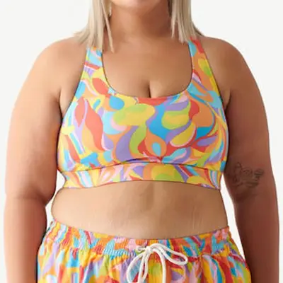 Humankind Swim Top in daytrip rainbow on model styled with matching trunks