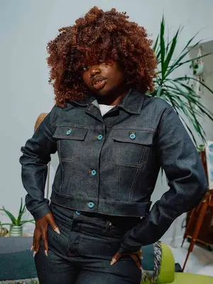 Person wearing denim jacket and pants set