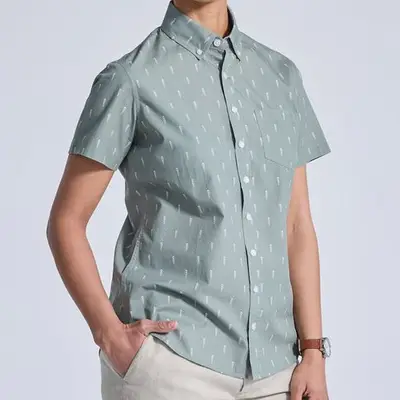 Kirrin Finch The Ray Cypress Short Sleeve Shirt in light green on model styled with khakis