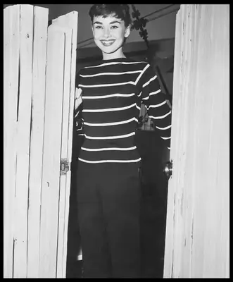 Audrey Hepburn wears striped top and black pants