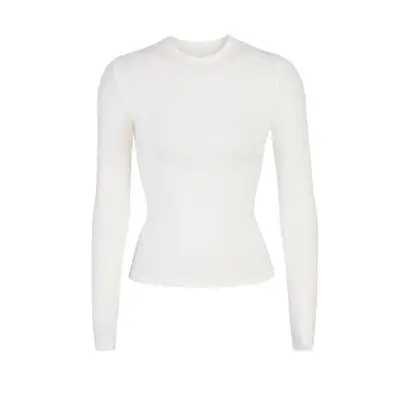 white long sleeve shirt against plain background