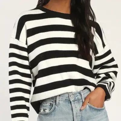model wearing black and white striped sweater