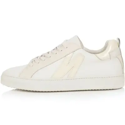 white sneakers against plain background