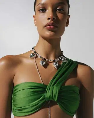 model wearing green bikini top