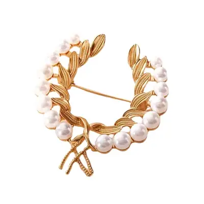 gold brooch with leaves and pearls
