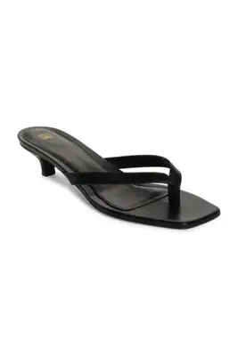 A Toteme heeled flip flop sandal.