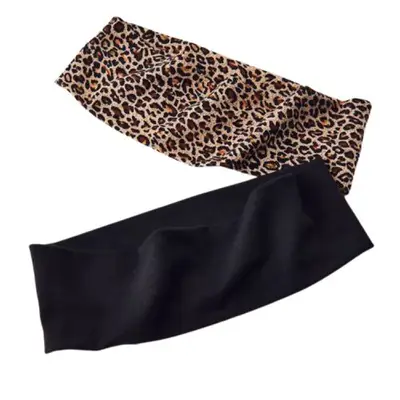 two headbands, one in leopard print and the other black