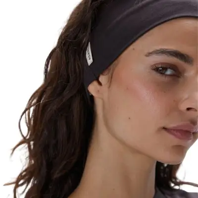 person wearing a brown headband