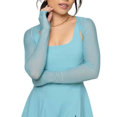 person wearing an athletic dress and mesh shrug in oasis blue