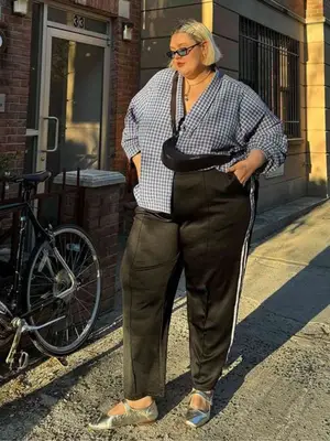 Abby Bible wearing track pants and a button-down shirt