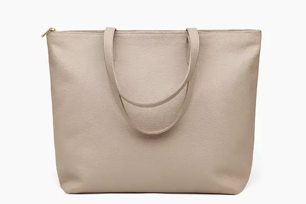 A close up of the zipper pocket in the Madewell The Transport Tote