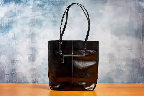 The Katte Vintage Genuine Leather Tote Shoulder Bag sitting on a wooden table