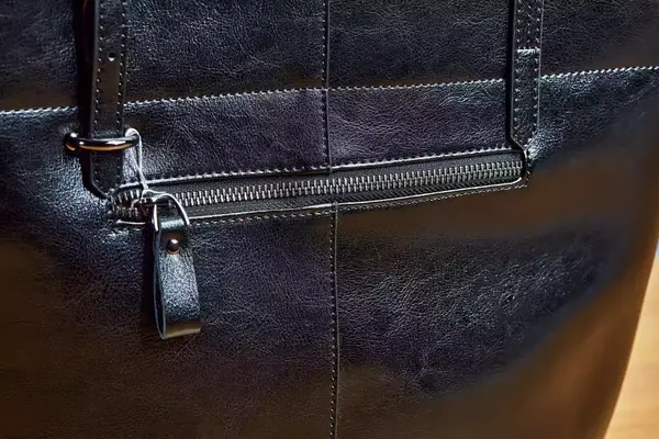 A close up of the zipper pocket on the outside of the Katte Vintage Genuine Leather Tote Shoulder Bag