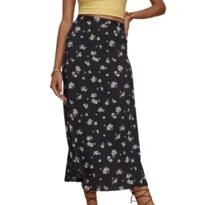 person wearing a black skirt with floral print