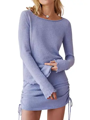 Model wearing a periwinkle knit set with a long sleeve top and mini skirt