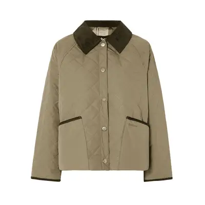 Two women wearing flowing skirts and tops and bohemian accessories at Glastonbury festival