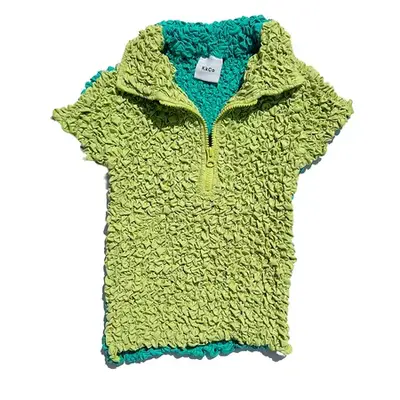 Model wearing Staud Eleanora black popcorn cropped top with light wash jeans