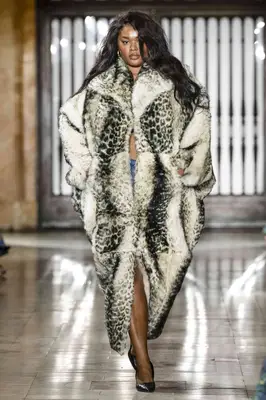 Precious Lee wears a leopard print fur coat at the Prabal Gurung fall 2025 show