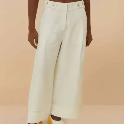 Model wearing off-white linen high waisted pants 