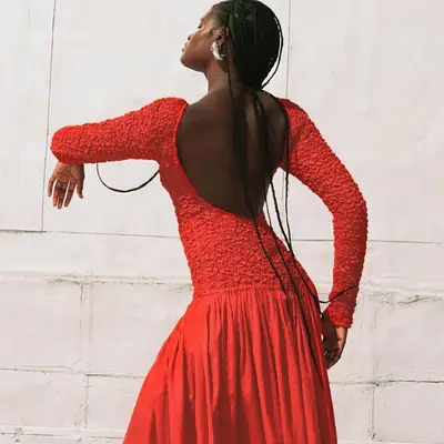 Model wearing a red Mara Hoffman dress